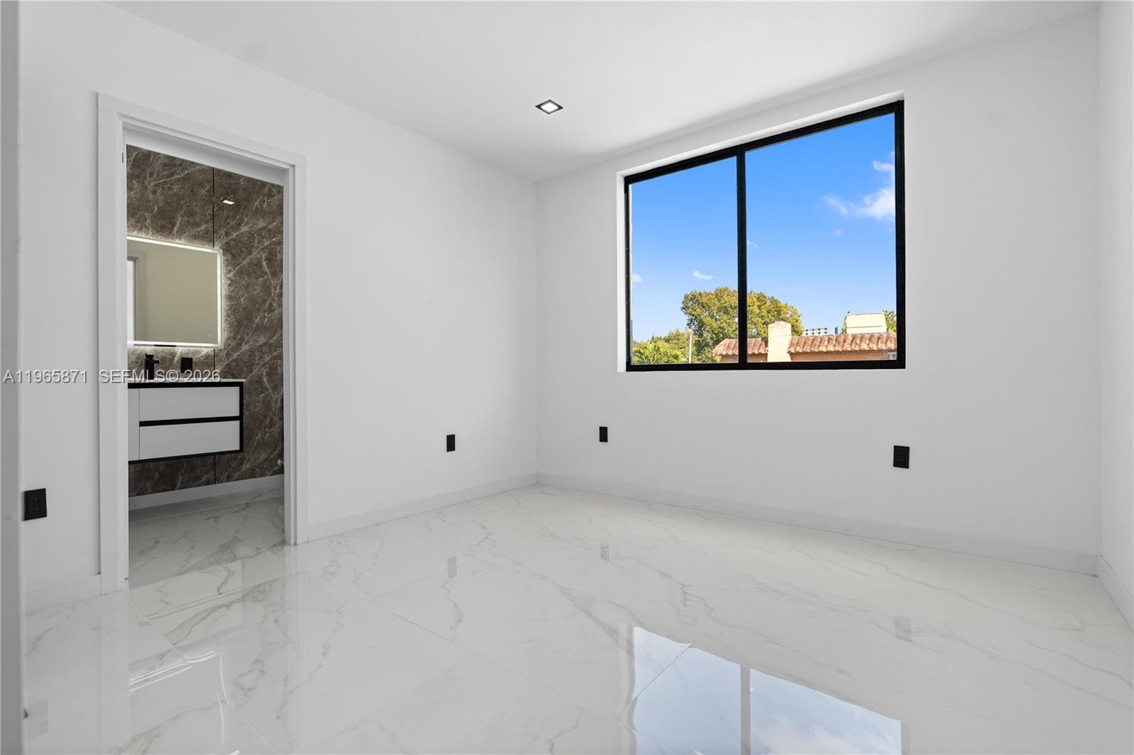 1644 Northwest 8th Terrace Miami, FL 33125 - Photo 37 of 60 a view of a room with a window and a hallway