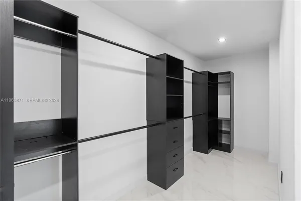 a view of a backyard with wooden fence