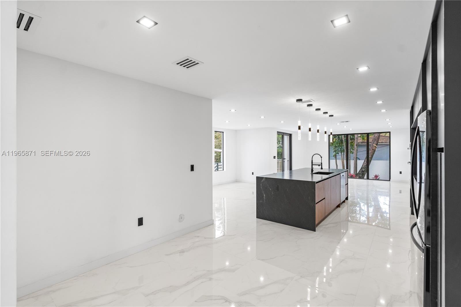 1644 Northwest 8th Terrace Miami, FL 33125 - Photo 5 of 60 a living room with furniture and a large window