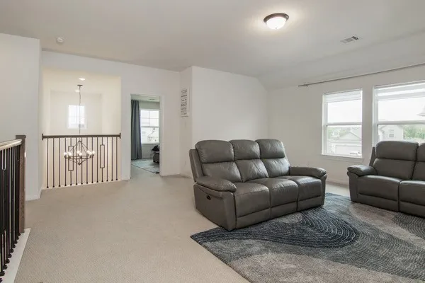 a bathroom with a sink a toilet a mirror and shower curtain