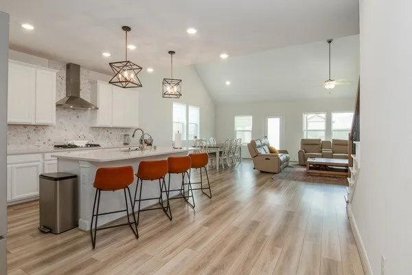 a living room with furniture fireplace and flat screen tv