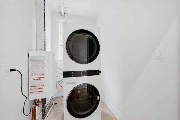a close view of a utility room with dryer and washer