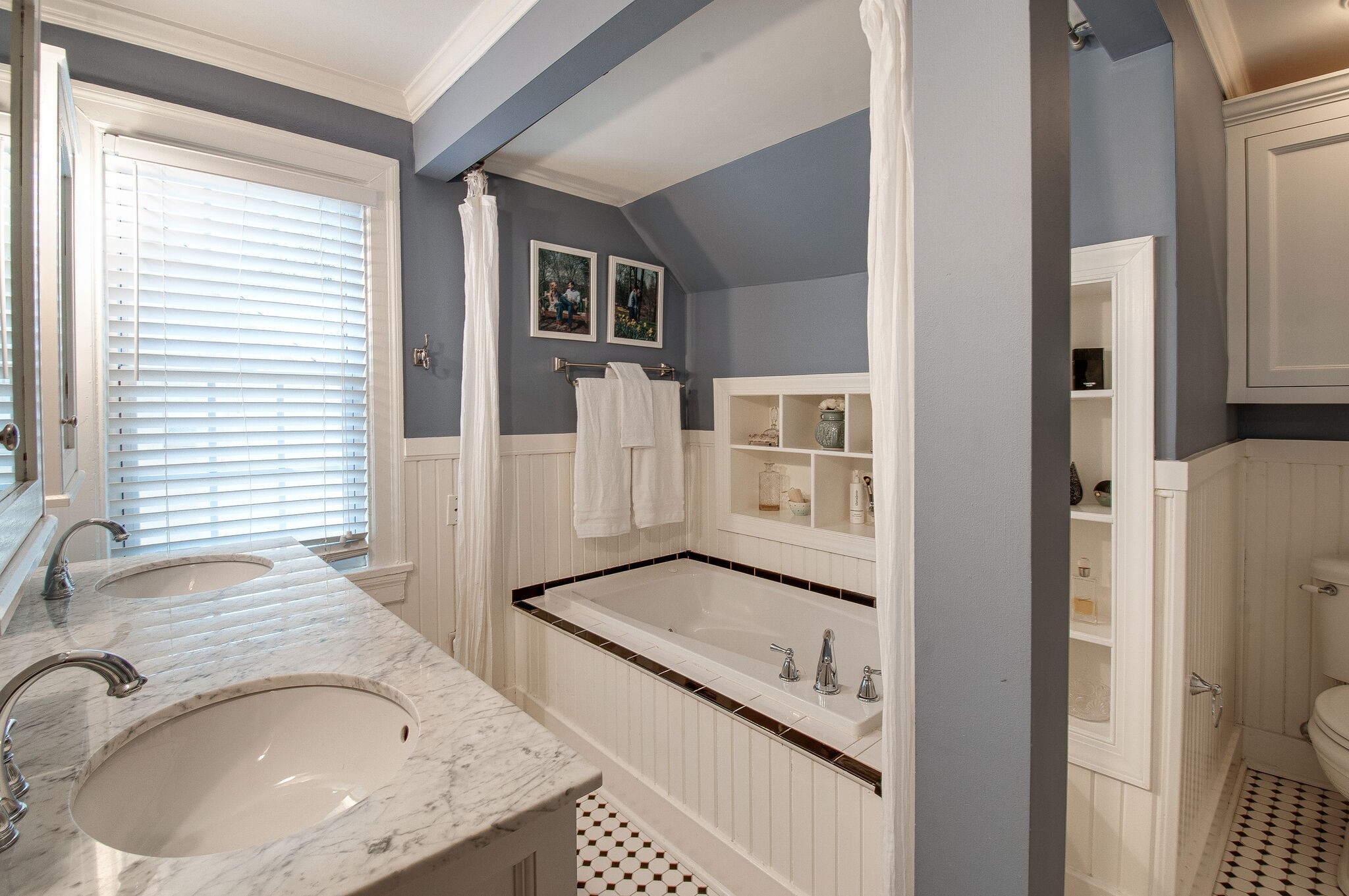 216 Cherokee Road Nashville, TN 37205 - Photo 33 of 39 a bathroom with a granite countertop sink a mirror and shower