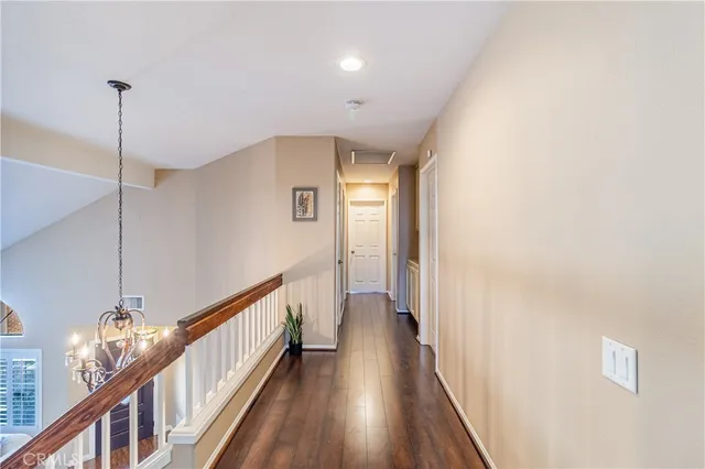 a bathroom with a granite countertop sink a toilet and mirror