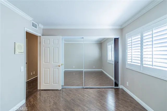a kitchen with stainless steel appliances a sink stove and cabinets