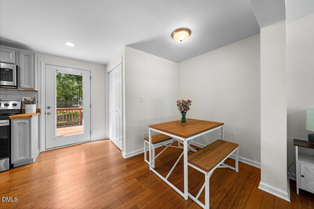 454 Cedar Creek Road Timberlake, NC 27583 - Photo 13 of 39 a room with wooden floor and windows