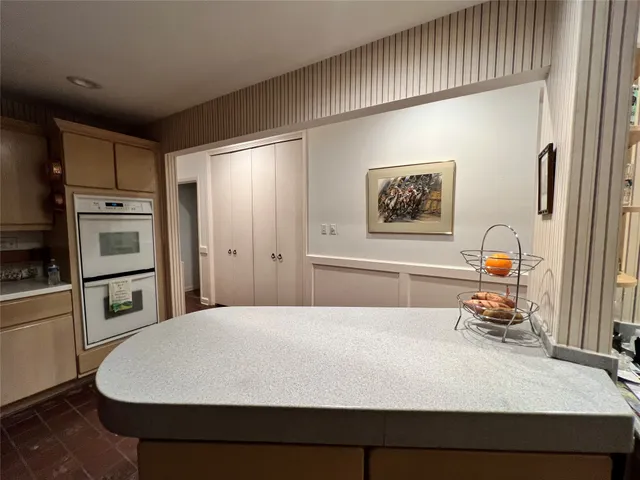a living room with lots of furniture and a book shelf