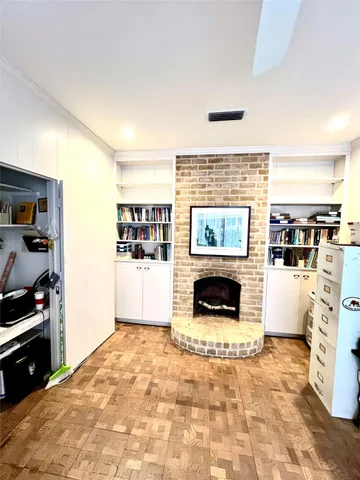 a view of a hallway with a kitchen