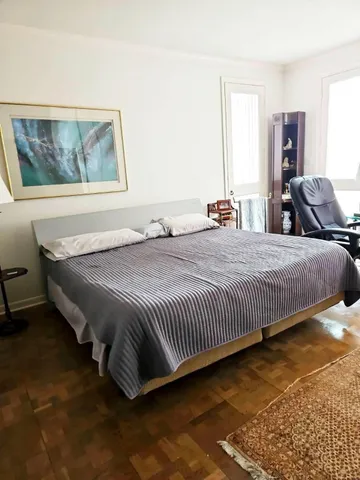 a view of hallway with wooden floor