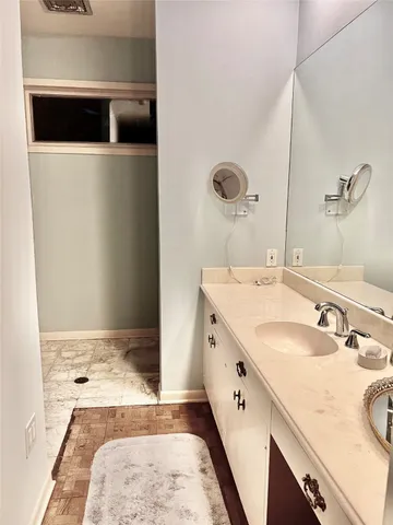 a bedroom with a bed and dresser