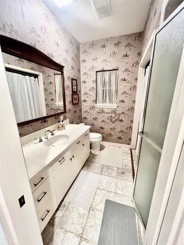 a bathroom with a sink and a shower