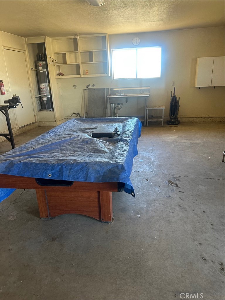 9772 Alamo Road Lucerne Valley, CA 92356 - Photo 20 of 24 a room with table chairs and windows