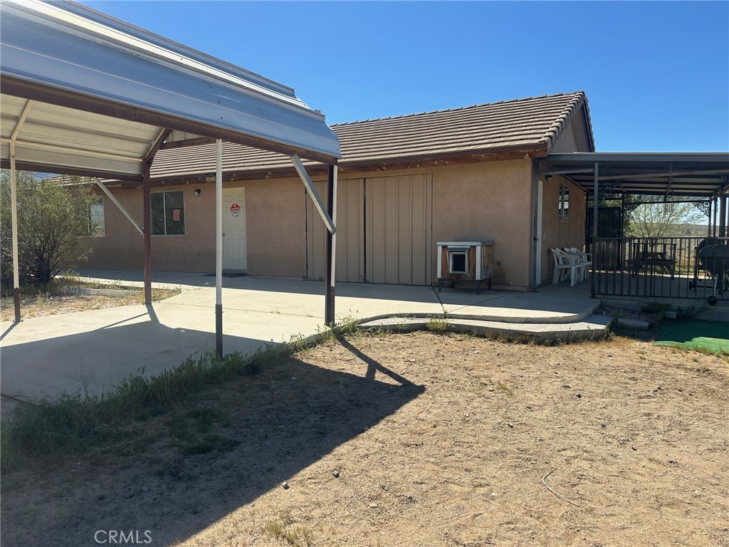 9772 Alamo Road Lucerne Valley, CA 92356 - Photo 2 of 24 a view of a house with backyard