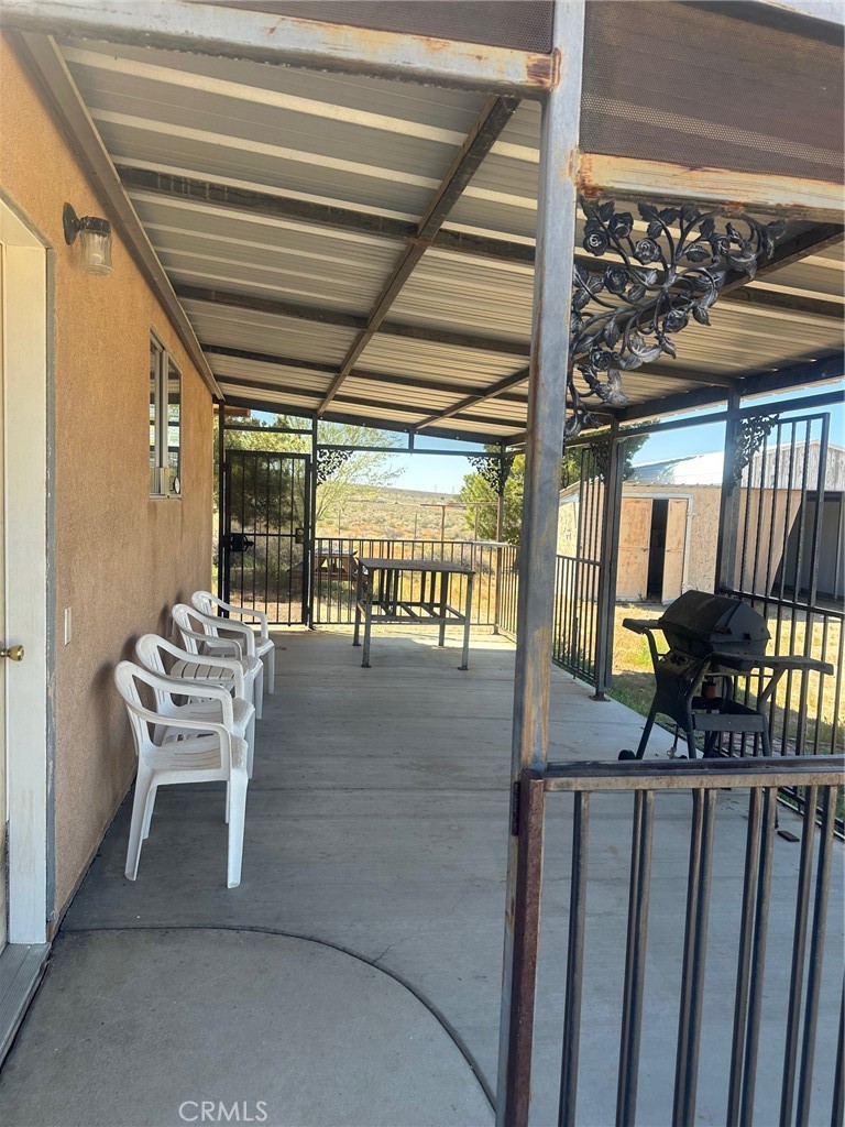 9772 Alamo Road Lucerne Valley, CA 92356 - Photo 21 of 24 a view of a porch with furniture