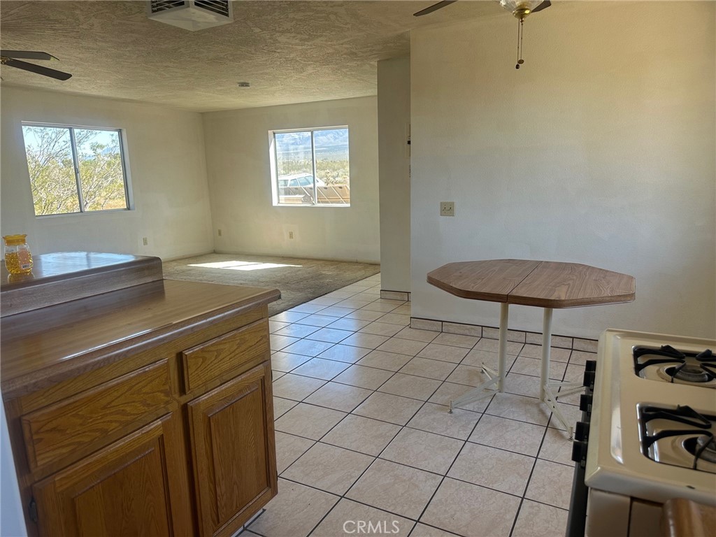 9772 Alamo Road Lucerne Valley, CA 92356 - Photo 24 of 24 a kitchen with a sink and cabinets