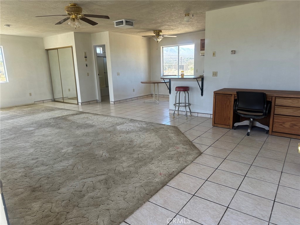 9772 Alamo Road Lucerne Valley, CA 92356 - Photo 8 of 24 a living room with furniture