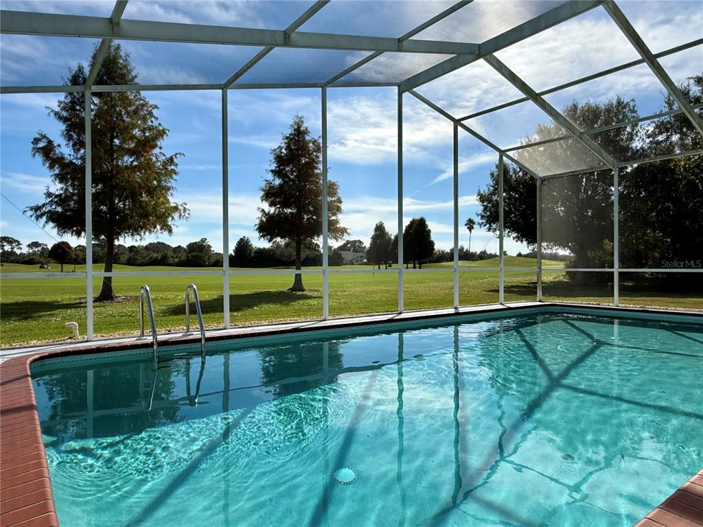 5614 Angelo Circle Sebring, FL 33872 - Photo 2 of 39 a view of a swimming pool with a yard and plants