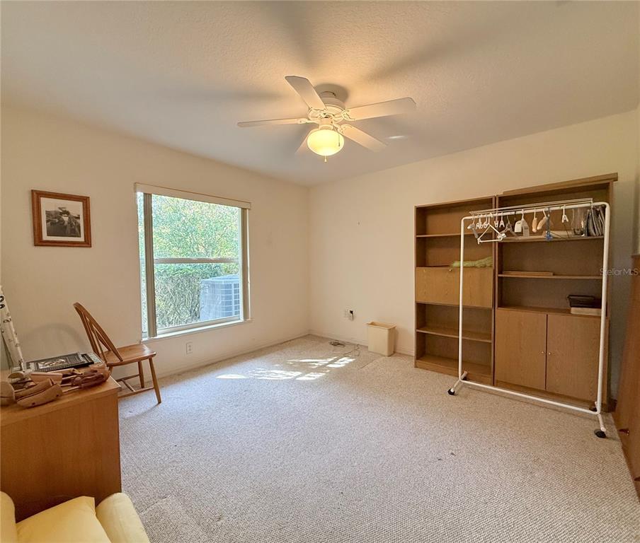 5614 Angelo Circle Sebring, FL 33872 - Photo 31 of 39 a view of a livingroom with furniture and a ceiling fan