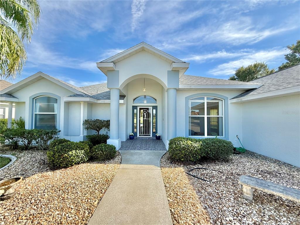 5614 Angelo Circle Sebring, FL 33872 - Photo 39 of 39 a front view of a house with garden