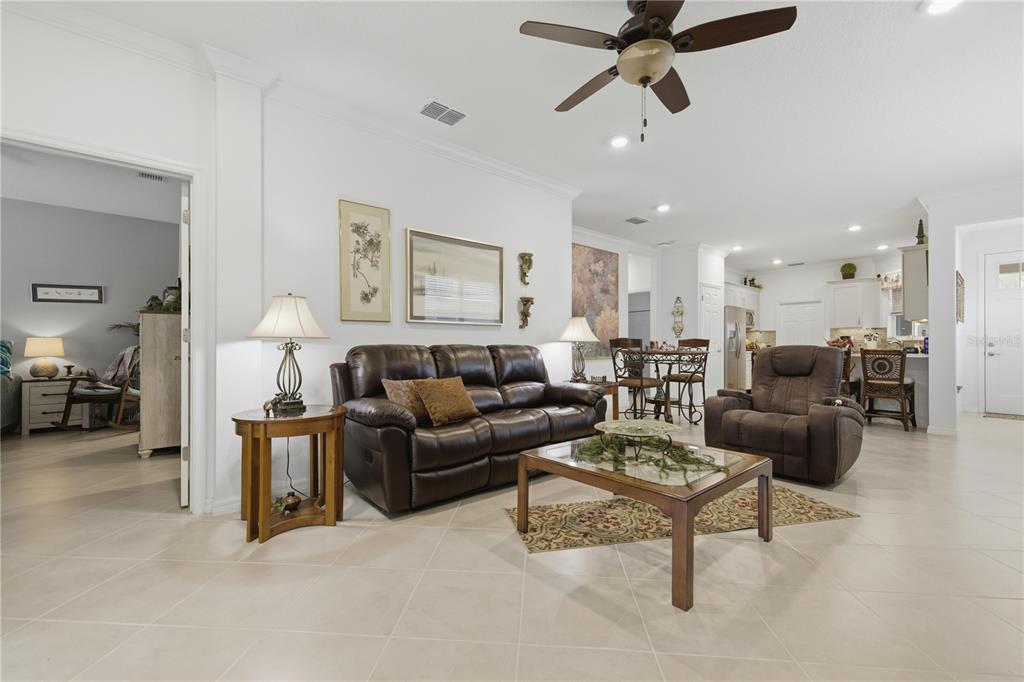 9680 Southwest 103rd Terrace Ocala, FL 34481 - Photo 11 of 24 a living room with furniture and a ceiling fan