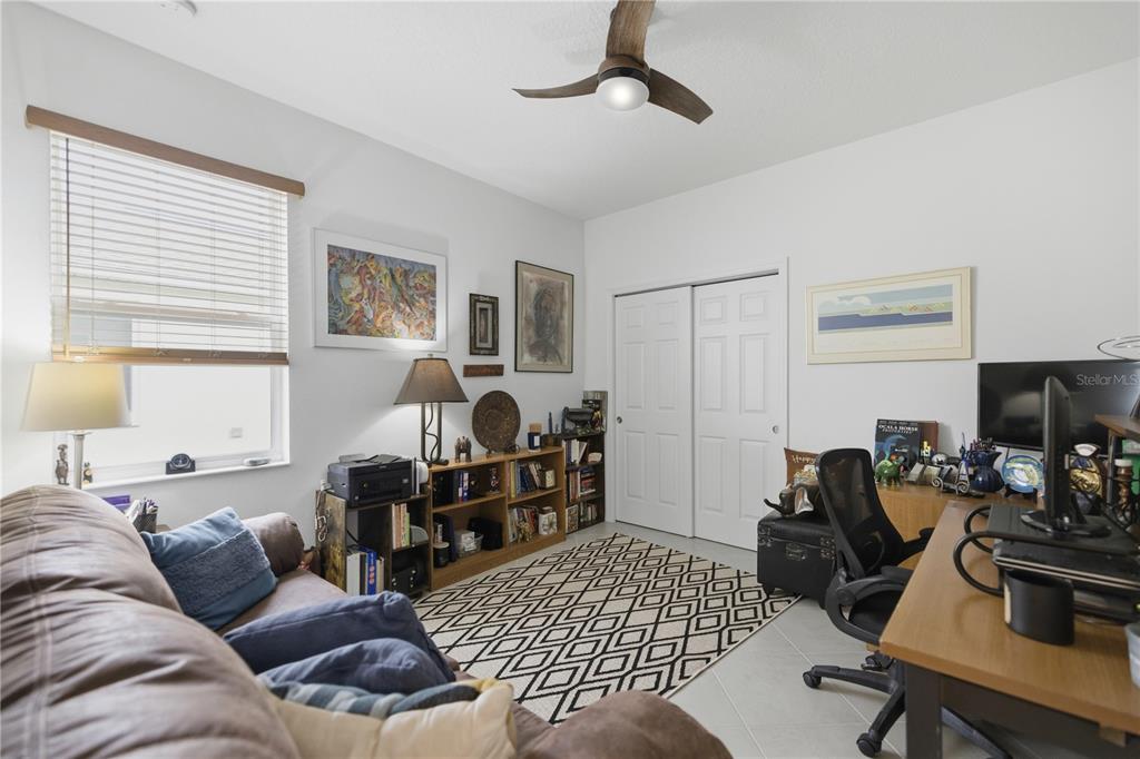 9680 Southwest 103rd Terrace Ocala, FL 34481 - Photo 15 of 24 a living room with furniture a piano and a window