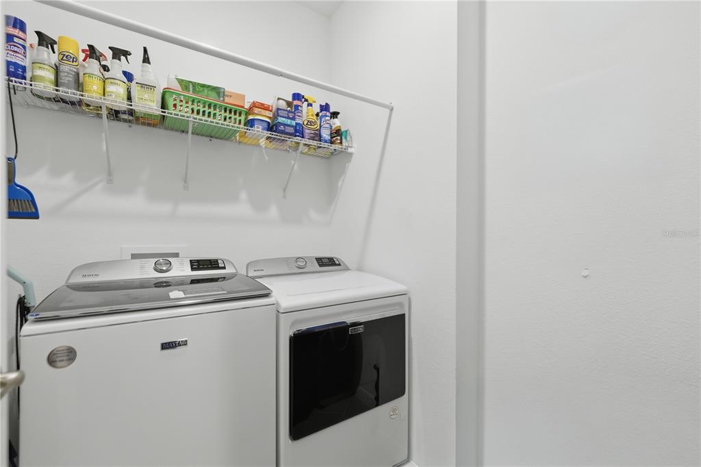 9680 Southwest 103rd Terrace Ocala, FL 34481 - Photo 18 of 24 a utility room with dryer and washer