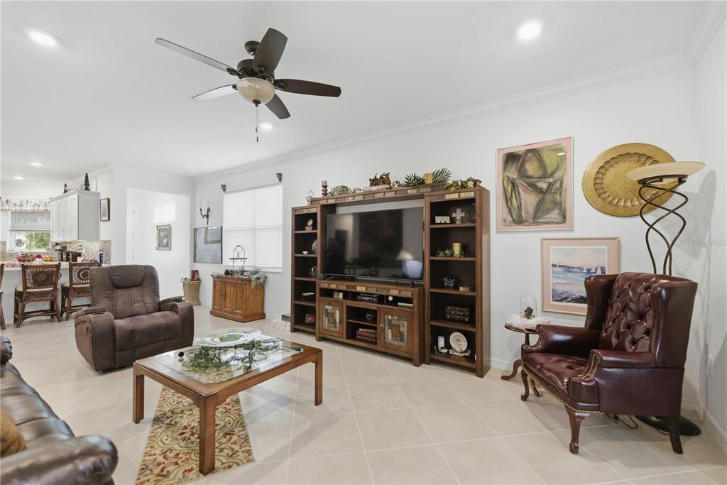 9680 Southwest 103rd Terrace Ocala, FL 34481 - Photo 7 of 24 a living room with furniture and a flat screen tv