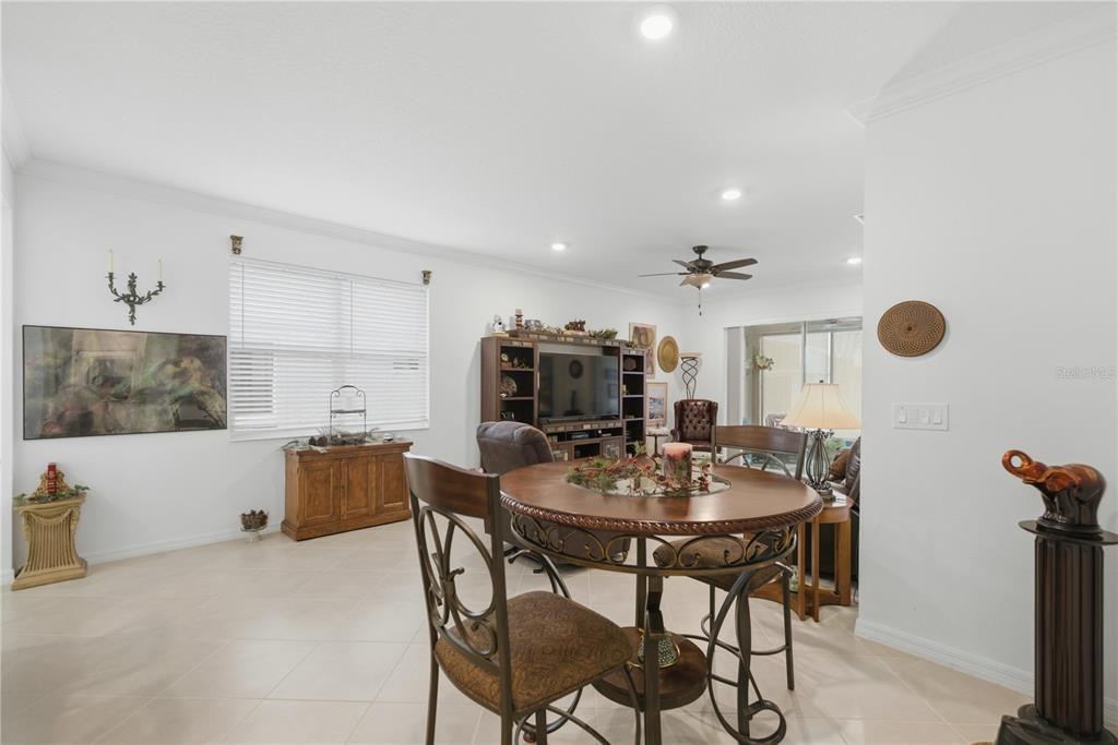 9680 Southwest 103rd Terrace Ocala, FL 34481 - Photo 8 of 24 a view of a dining room with furniture