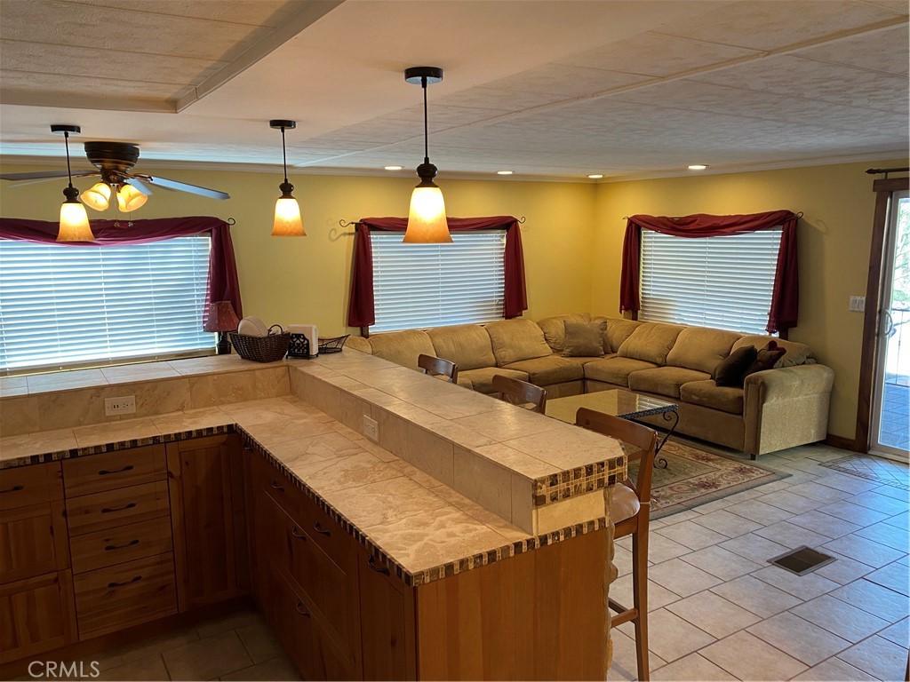 a living room with furniture and a lamp