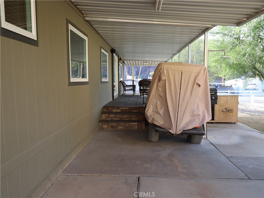 451 Parker Dam Road, Unit B1 Parker Dam, CA 92267 - Photo 30 of 36 a view of a backyard with a large window and furniture