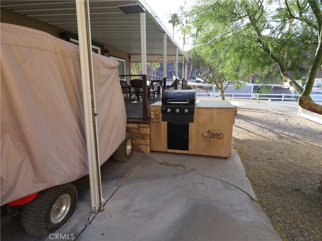 451 Parker Dam Road, Unit B1 Parker Dam, CA 92267 - Photo 31 of 36 a view of a patio with table and chairs and couches
