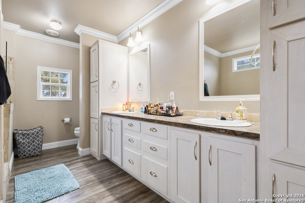 201 Private Road 1524 Bandera, TX 78003 - Photo 17 of 36 a spacious bathroom with double sink and a large mirror