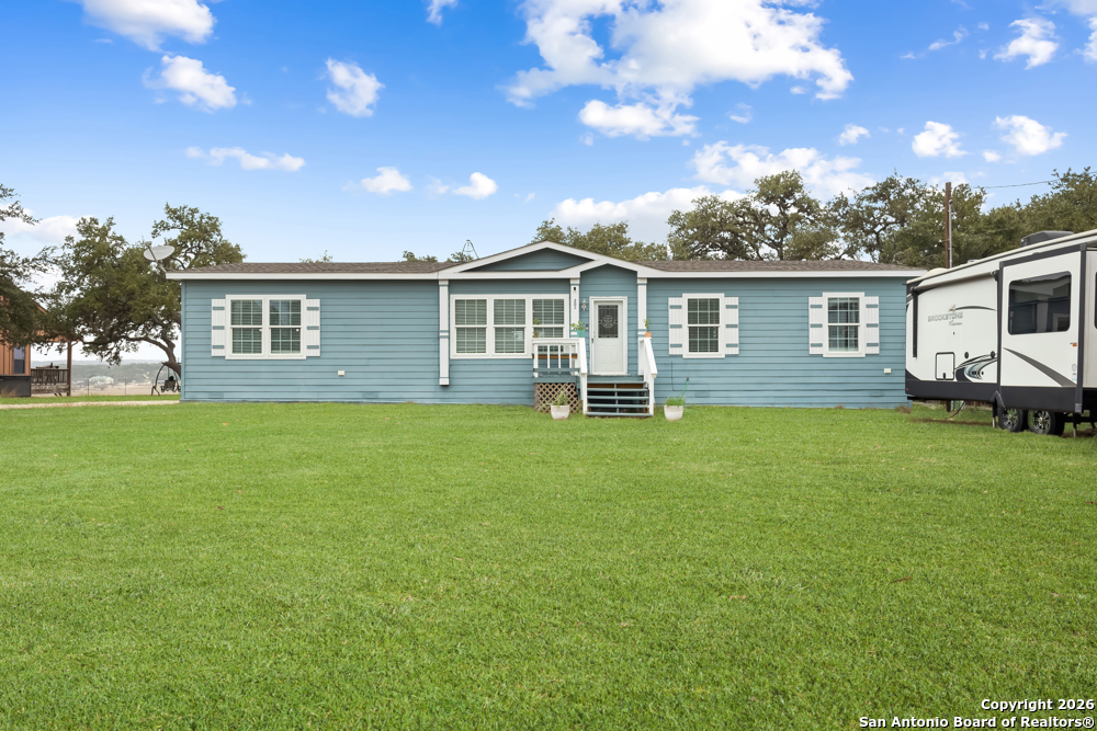 201 Private Road 1524 Bandera, TX 78003 - Photo 2 of 36 a view of a house with a backyard