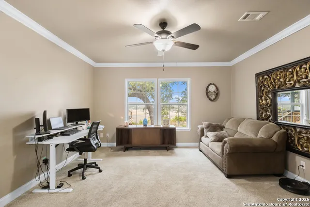 a living room with furniture and windows
