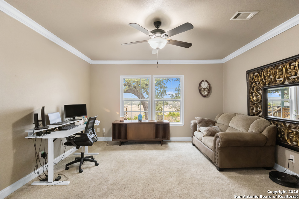 201 Private Road 1524 Bandera, TX 78003 - Photo 21 of 36 a living room with furniture and windows
