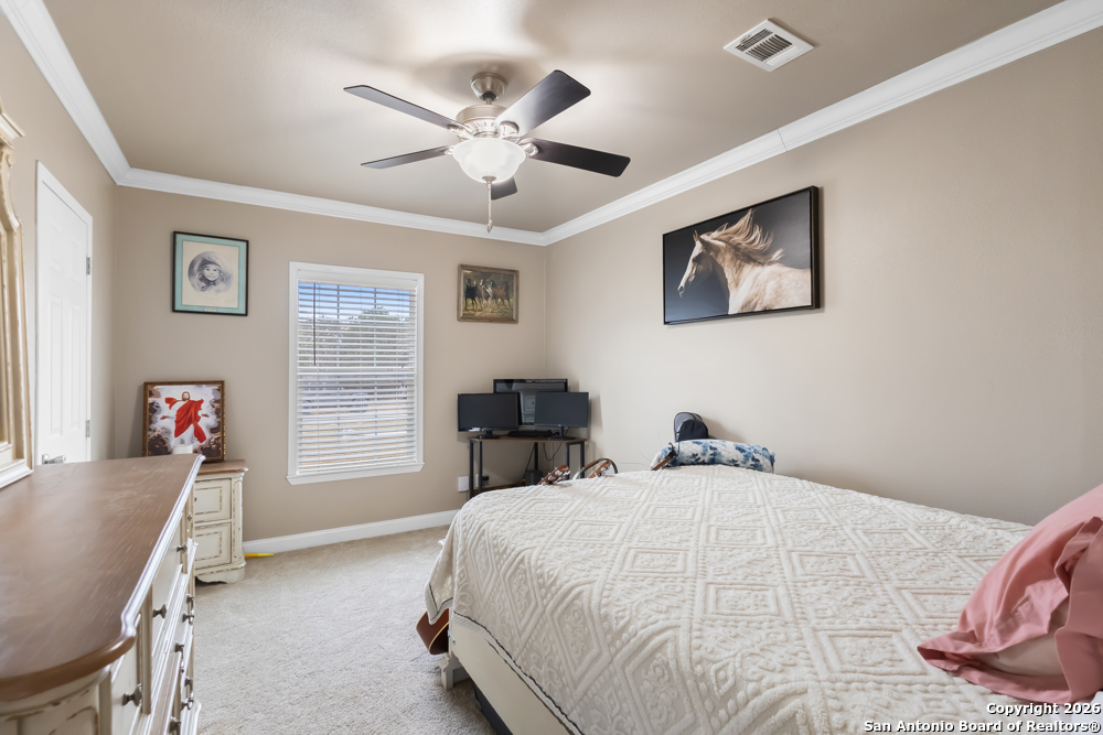 201 Private Road 1524 Bandera, TX 78003 - Photo 23 of 36 a bedroom with a bed and a window