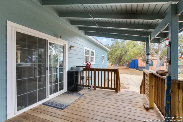 a view of a balcony with wooden floor