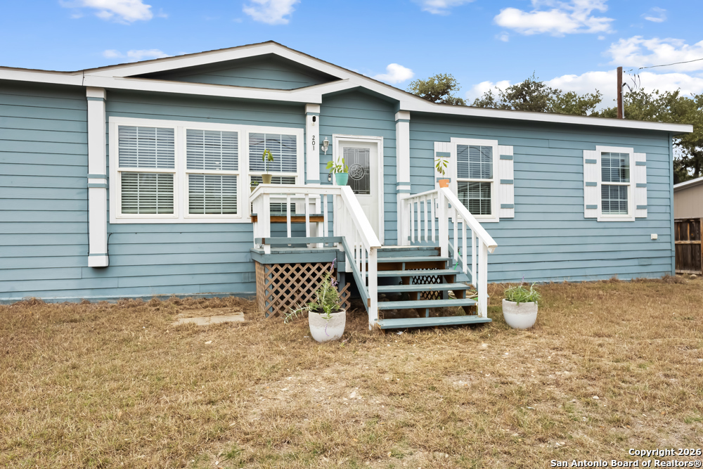 201 Private Road 1524 Bandera, TX 78003 - Photo 36 of 36 a front view of a house with a yard