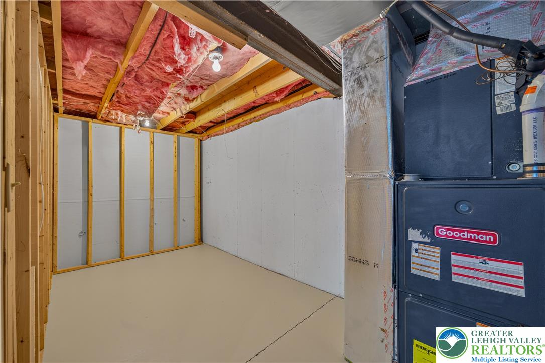 630 Clearfield Road Nazareth, PA 18064 - Photo 84 of 100 Concrete floors and exposed framing offer a blank canvas in this unfinished basement utility space.