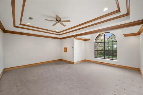 a room with walk in closet and window