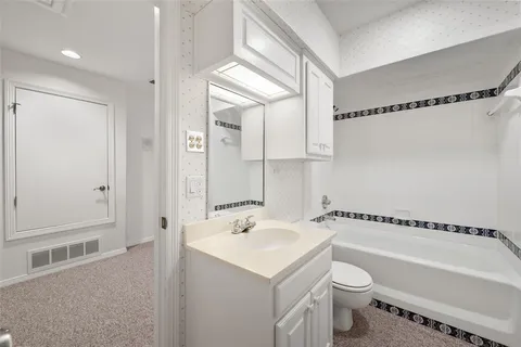a kitchen with stainless steel appliances granite countertop a stove and a refrigerator