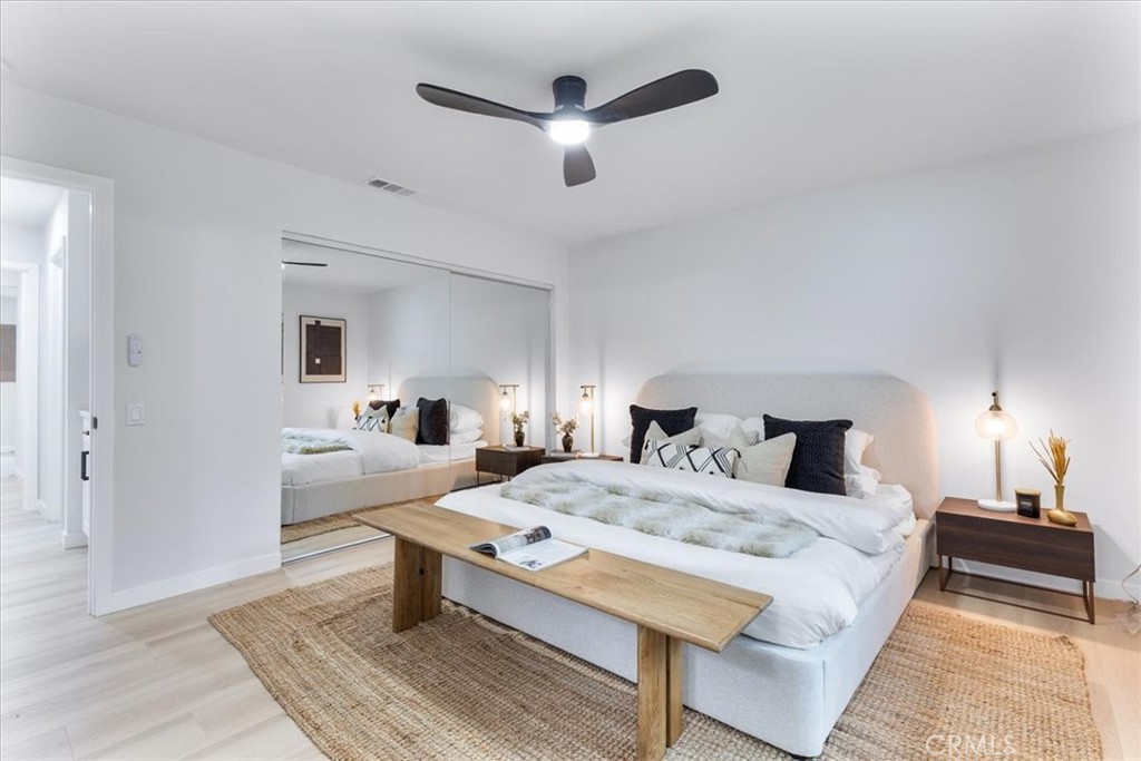 26005 Adamor Road Calabasas, CA 91302 - Photo 15 of 34 a bedroom with a bed and a chandelier