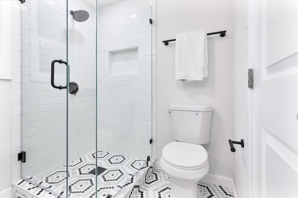 26005 Adamor Road Calabasas, CA 91302 - Photo 18 of 34 a bathroom with a toilet sink and shower