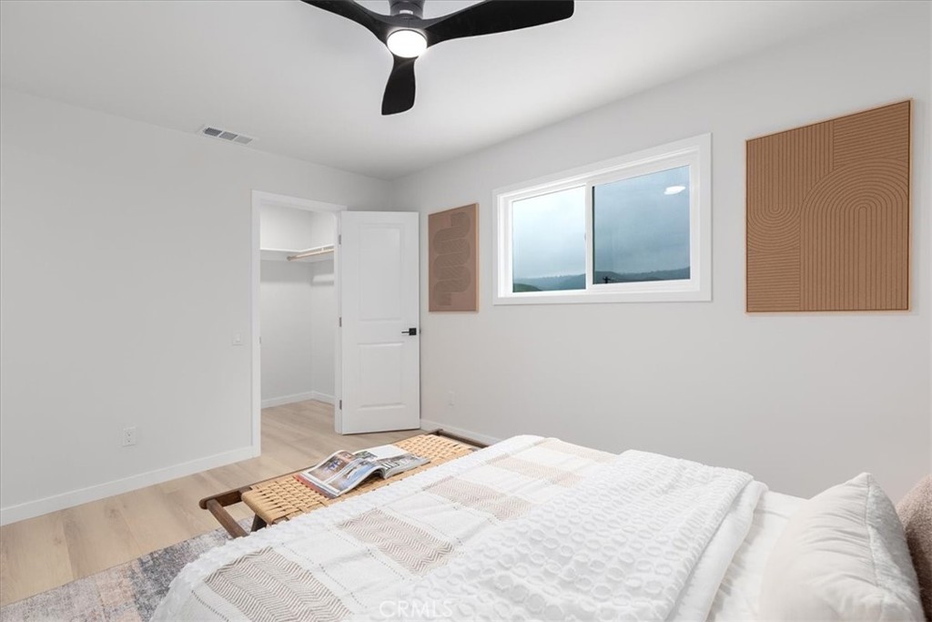 26005 Adamor Road Calabasas, CA 91302 - Photo 27 of 34 a bedroom with a bed and a window