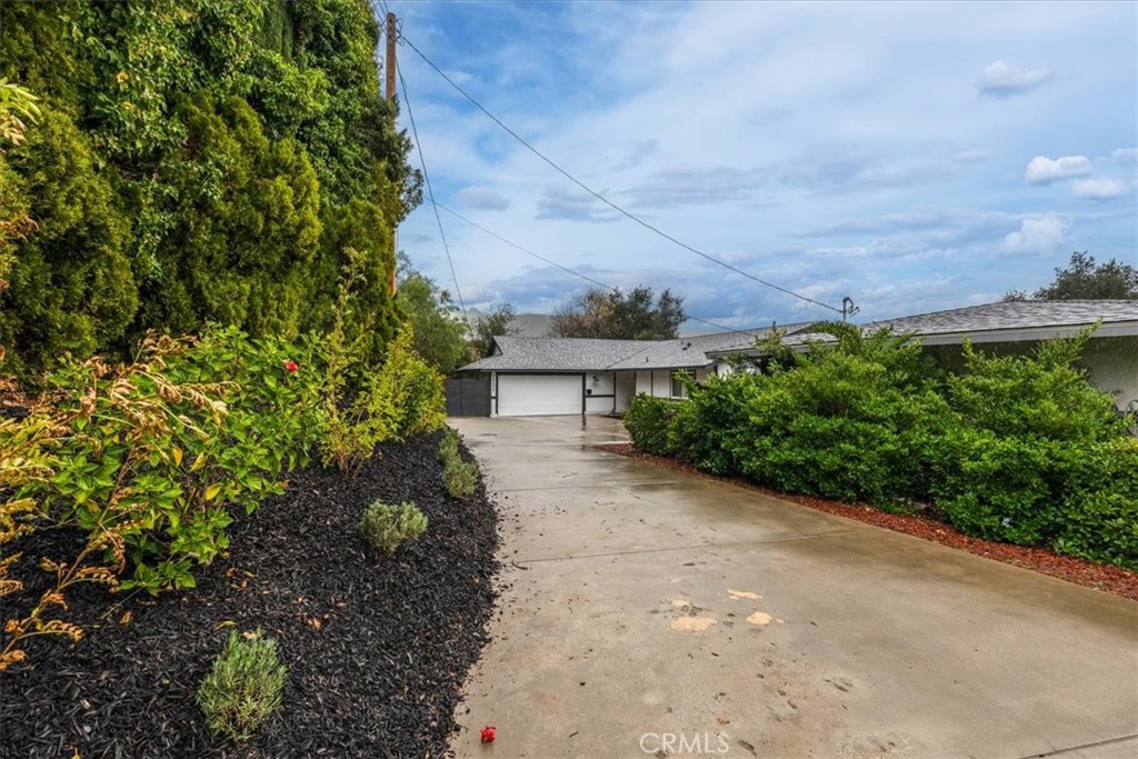 26005 Adamor Road Calabasas, CA 91302 - Photo 3 of 34 a view of a garden with pathway