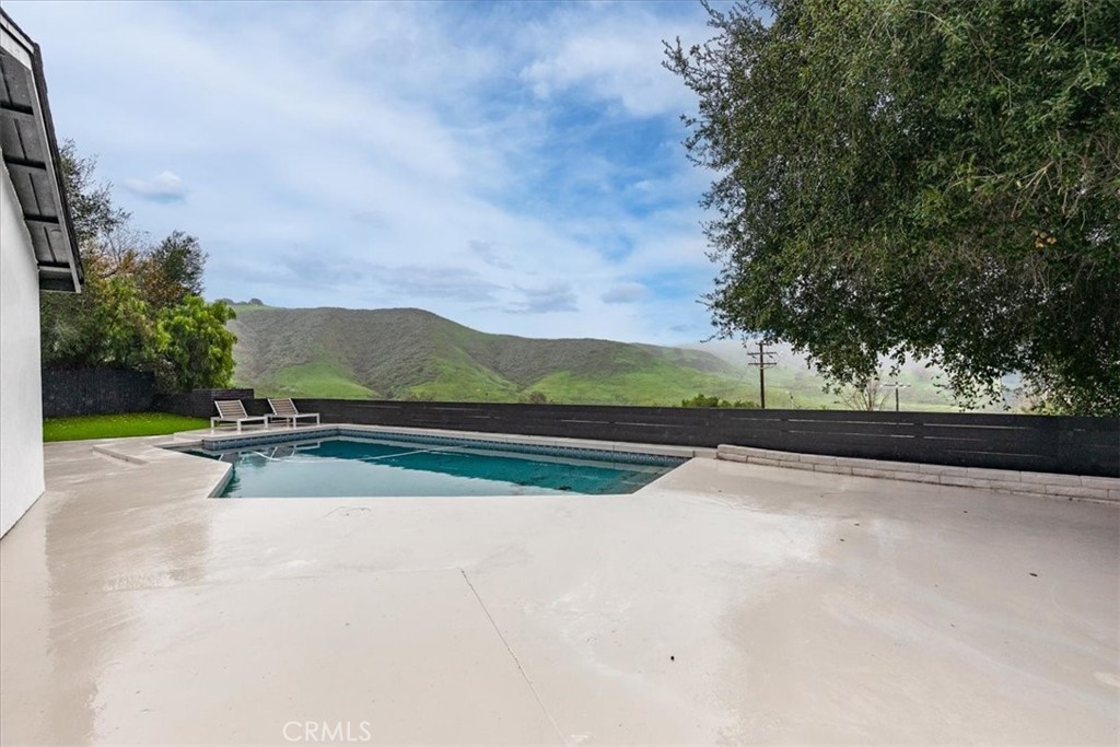 26005 Adamor Road Calabasas, CA 91302 - Photo 31 of 34 a view of swimming pool with a yard