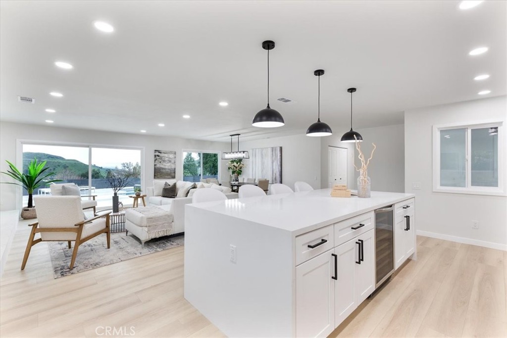 26005 Adamor Road Calabasas, CA 91302 - Photo 7 of 34 a view of kitchen with living room and white furniture