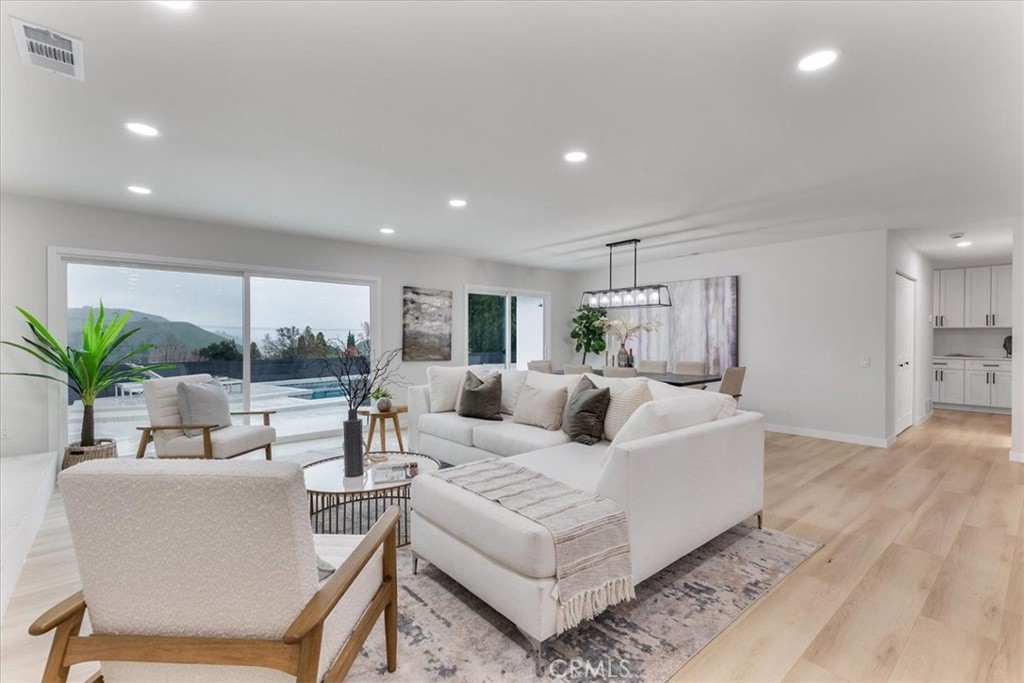 26005 Adamor Road Calabasas, CA 91302 - Photo 10 of 34 a living room with furniture and a large window