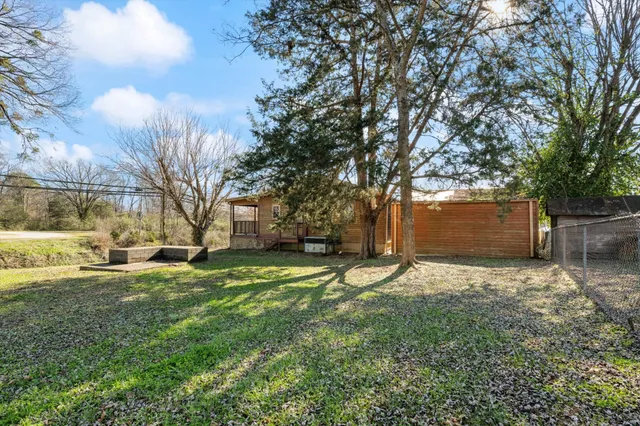 an aerial view of a house with a ocean view
