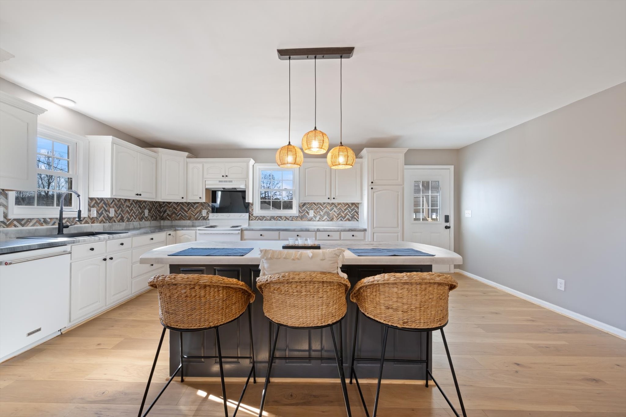 245 South Mill Street Linden, TN 37096 - Photo 6 of 30 a view of a kitchen with granite countertop a dining table and chairs